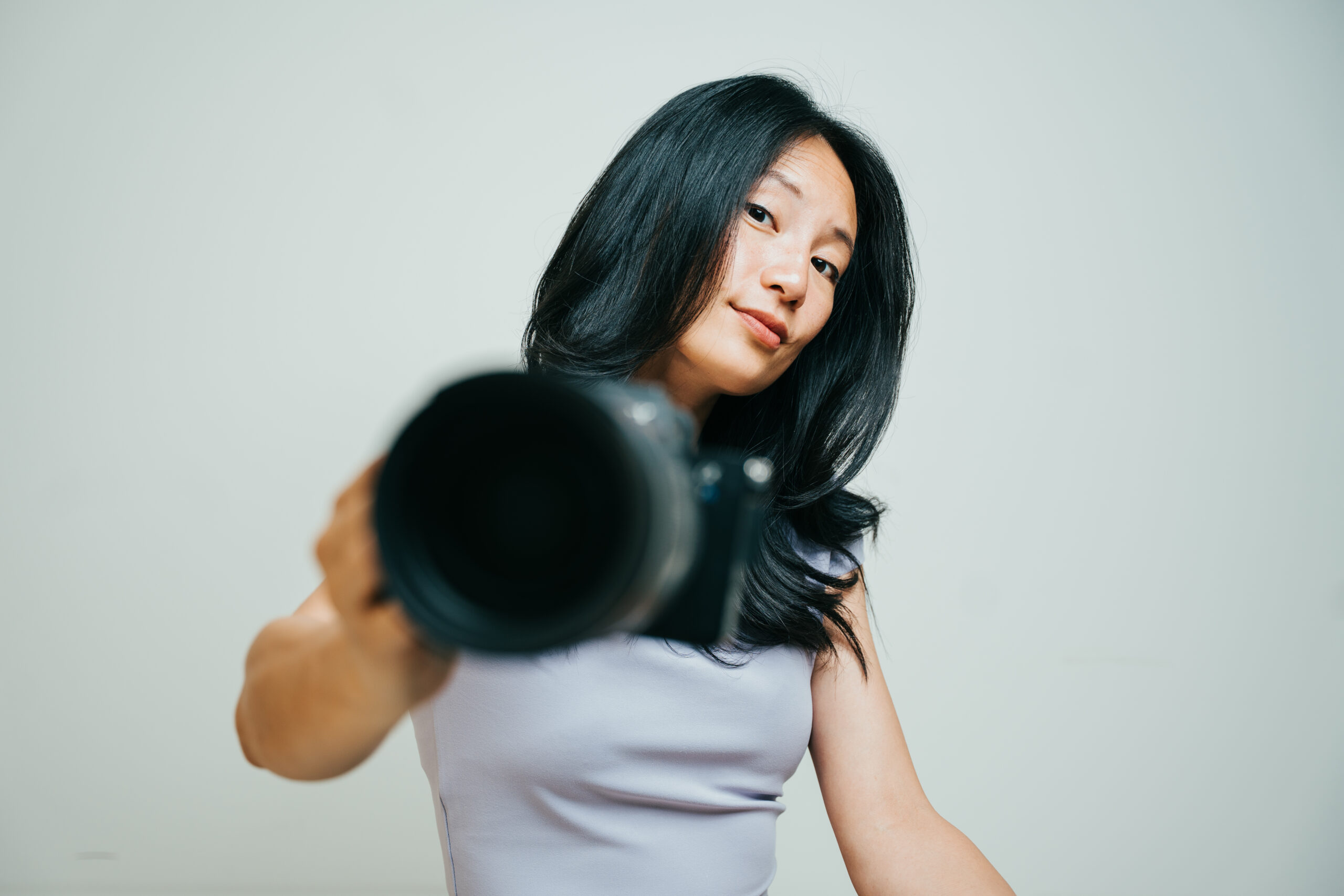 Photographer brandishes camera