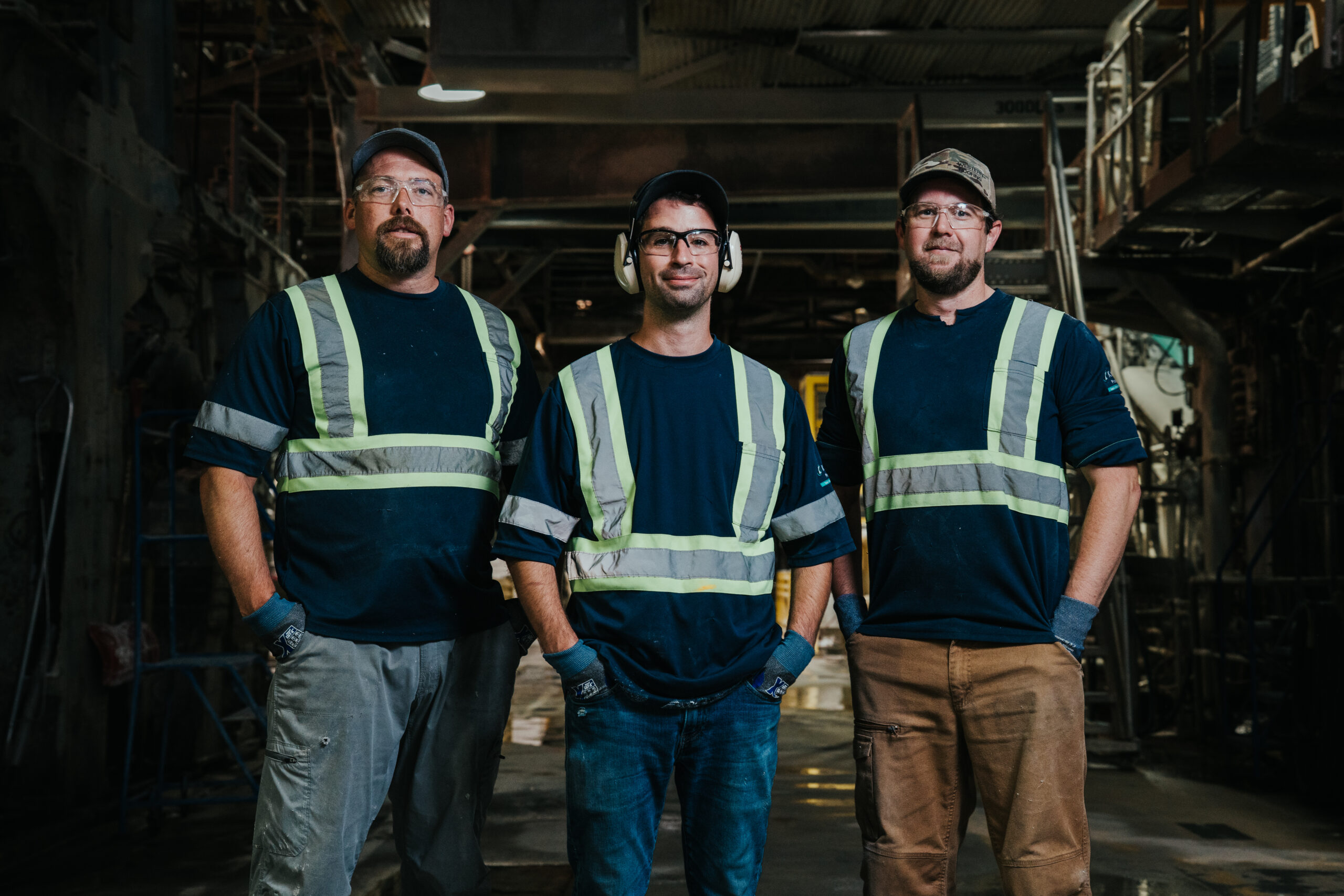 creativebyamy-krugerproducts-employees-7400251 Paper mill employees pose in front of machinery